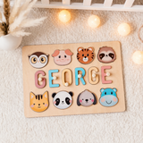 Personalised wooden name puzzle board with the name George in pastel letters and animal pieces