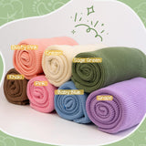 Knit blanket colour options: dusty pink, cream, sage green, khaki, pink, baby blue, grape