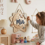 Layered wooden nursery name sign with the name Mia on a star and cloud design