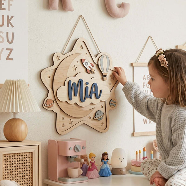 Layered wooden nursery name sign with the name Mia on a star and cloud design